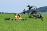 Foster mothers Katharina Huchler (front) and Helena Wehner with juvenile birds and microlight airplane --- Copyright Research 2021 for free use